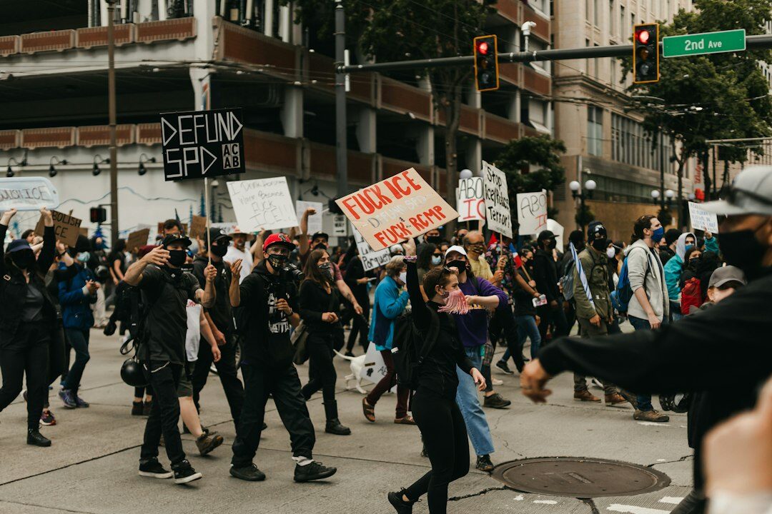 protesters holding signs against corporations