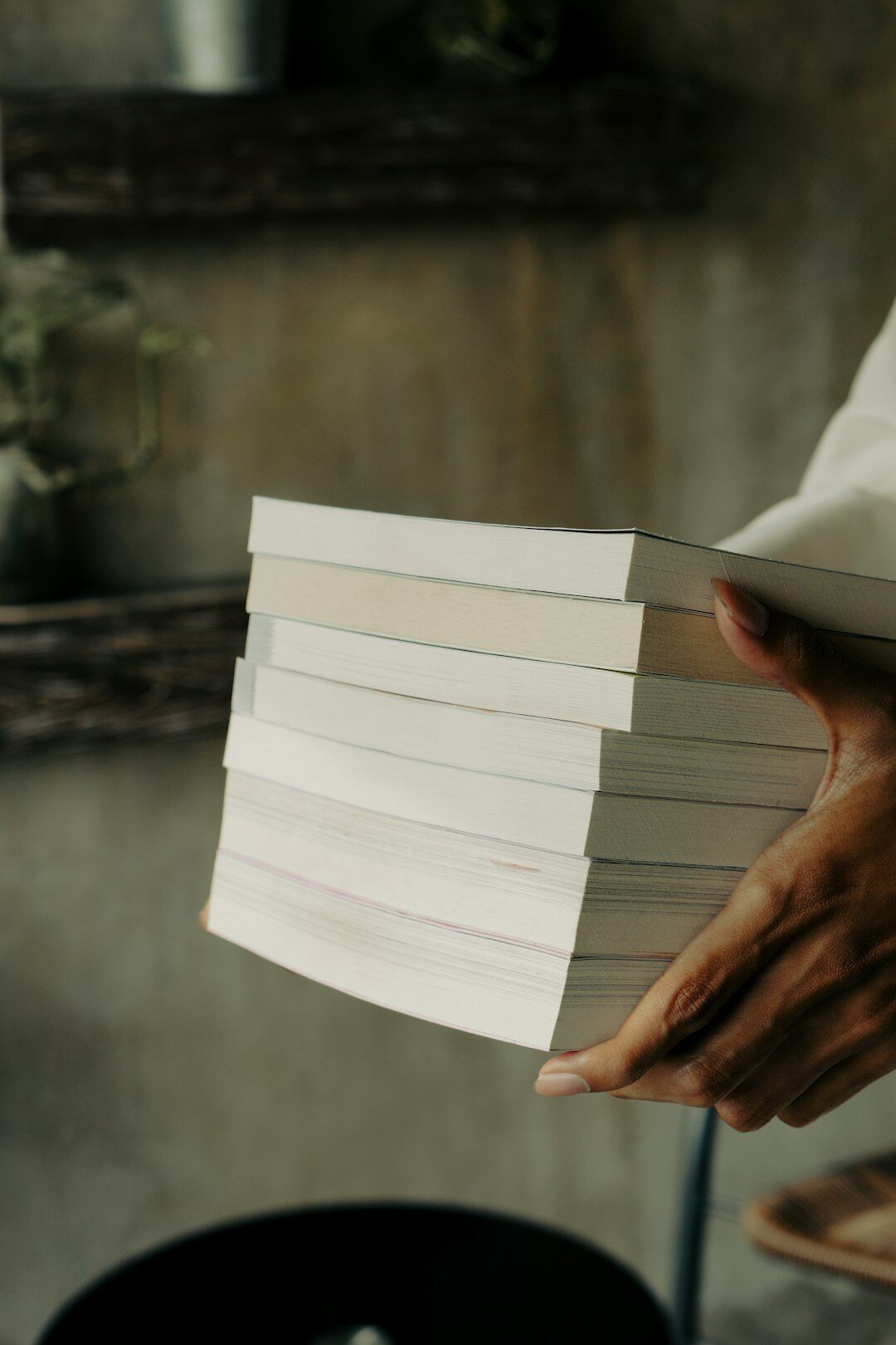 Stacks of printed documents and paper files on a desk