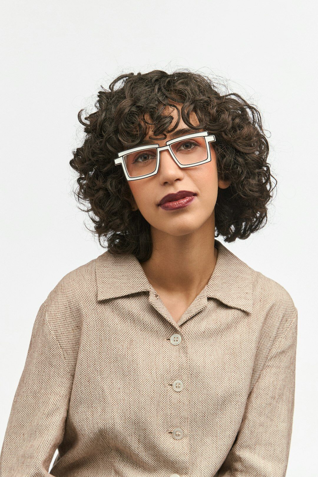 Studio portrait of a Portuguese man financial reporter with glasses