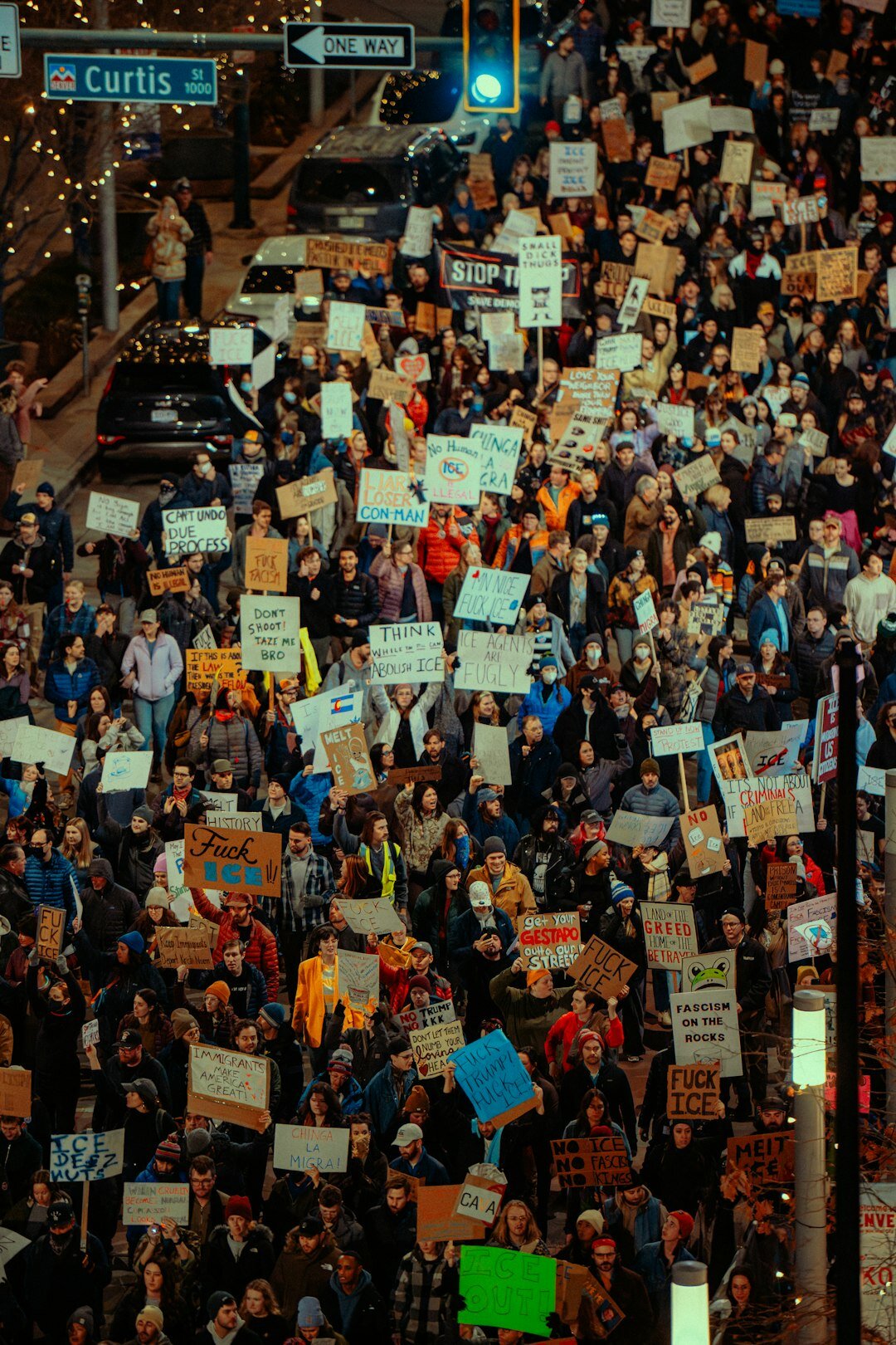 protesters holding signs against corporations